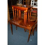 A REPRODUCTION MAHOGANY FOLD OVER CARD TABLE together with a similar nest of three tables (23)