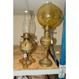 TWO BRASS OIL LAMPS, the small on trefoil base, height 34cm (not including glass funnel), the