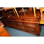 AN OLD CHARM OAK SIDEBOARD with three drawers, width 188cm x depth 44cm x height 86cm