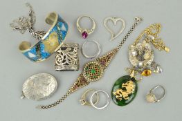 A SELECTION OF JEWELLERY, to include an oval nephrite jade pendant, an oval silver locket, with