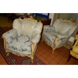 A PAIR OF EARLY 19TH CENTURY GILTWOOD AND PAINTED ROCOCO ARMCHAIRS with pale blue floral upholstery