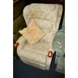 AN UPHOLSTERED ELECTRIC RECLINING ARMCHAIR