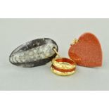 TWO PENDANTS AND A RING to include a goldstone heart, a fossil pendant and a dress ring which has an