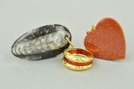 TWO PENDANTS AND A RING to include a goldstone heart, a fossil pendant and a dress ring which has an