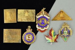 THREE SILVER MEDALLIONS, FOUR SILVER STAMOS AND A BROOCH, the medallions all with enamel detail, the