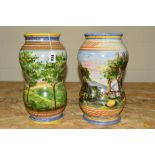 A PAIR OF PAINTED ITALIAN FAICENCE STYLE VASES DECORATED WITH COUNTRY SCENES, approximate height