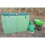 A LARGE GREEN GARDEN STORAGE BOX, two hose reels with another, plastic wheel barrow and a smaller