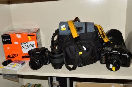 A SONY A300 DIGITAL SLR CAMERA, fitted with a 18-55 f3.5 lens with box and 5-CF cards (no battery or