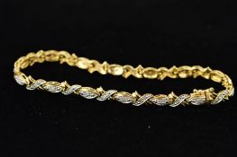 A DIAMOND SET BRACELET, designed as boat shape and tapered cross shape links each set with a