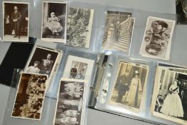 A POSTCARD ALBUM, loosely inserted, collection of cards from Victorian to mid 20th century showing