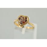 A MID TO LATE TWENTIETH CENTURY GARNET HEART SHAPED CLUSTER RING, ring size M, stamped '9ct',