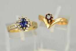 TWO LATE 20TH CENTURY GEM RINGS to include a 9ct gold garnet single stone wishbone ring, ring size