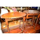 A PAIR OF OAK BARLEY TWIST OVAL TOPPED OCCASIONAL TABLES (2)