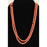 AN EARLY 20TH CENTURY CORAL BEAD NECKLACE, the graduated beads measuring 3mm to 7mm, to the spring