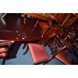 A MODERN DROP LEAF DINING TABLE, six chairs including two carvers and a sideboard with three various