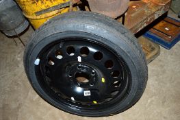 A SPACE SAVER WHEEL AND TYRE suitable for a Vauxhall Astra