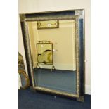 A MODERN RECTANGULAR BEVELLED EDGE WALL MIRROR, 110cm x 79cm