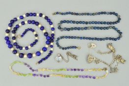 A COLLECTION OF JEWELLERY to include a silver bracelet with assorted charms, a lapis lazuli and