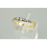 A THREE STONE DIAMOND RING designed as three single cut diamonds within a rub over settings to the