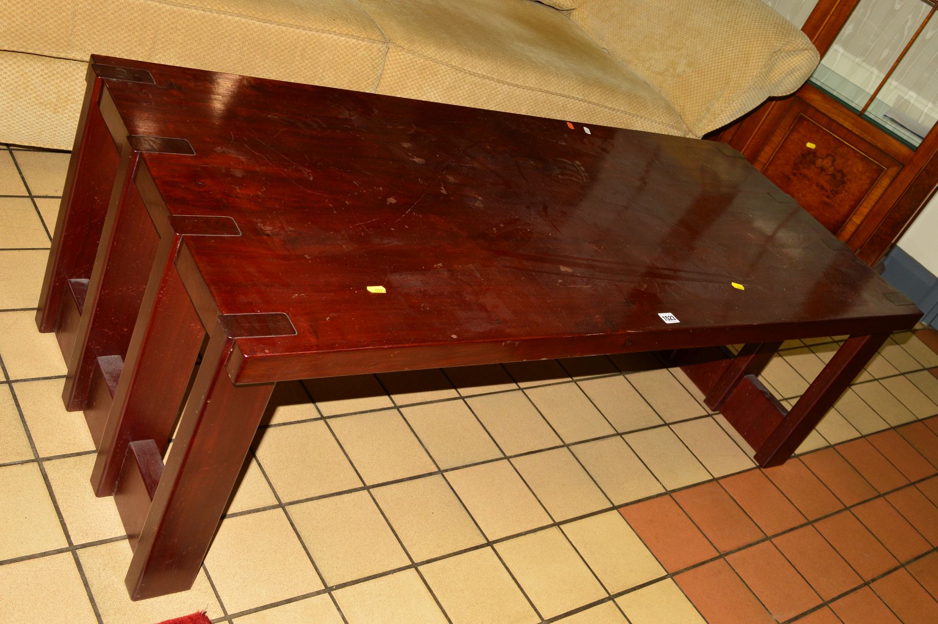 A 1970's/80's hardwood coffee table on slatted base to each end, width 146cm x depth 61cm x height