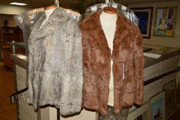 TWO CONEY FUR JACKETS, the first in brown is size 16, the second in grey is sized as 42