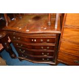 A REPRODUCTION MAHOGANY SERPENTINE CHEST of four long graduating drawers below a brushing slide,