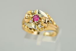 A RUBY DRESS RING, the central circular ruby within a claw setting, to the layered, vari-shaped,