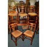 A SET OF SIX EARLY 20TH CENTURY OAK DINING CHAIRS with shaped backs