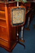 A GEORGIAN MAHOGANY POLESCREEN with needlework detail (sd)