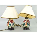 A PAIR OF MOORCROFT TABLE LAMPS WITH SHADES, stylized Birds & Trees, approximate height 22cm (not