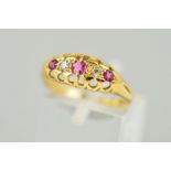 AN EARLY 20TH CENTURY 18CT GOLD RUBY AND DIAMOND RING designed as three graduated circular rubies