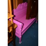 A PINK PAINTED HALL SETTLE with a hinged storage compartment