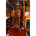 AN EDWARDIAN MAHOGANY WIG STAND with two drawers