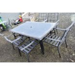 AFRAMED GARDEN TABLE with a glass insert, together with six matching chairs (7)