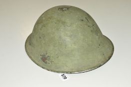 A BRITISH ARMY ISSUE MKIV CIRCA 1950-60 HELMET, with liner, strap etc