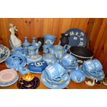 A LARGE GROUP OF WEDGWOOD JASPERWARES, mostly light blue teawares and trinkets, a black bowl and two