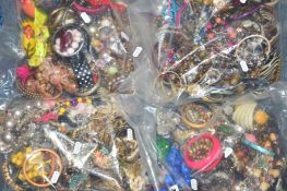 FOUR BAGS OF COSTUME JEWELLERY