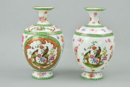 A PAIR OF PORCELAIN VASES, printed birds and foliage detail, height 22.5cm (2)