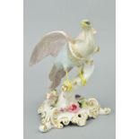 A ROYAL CROWN DERBY CHELSEA BIRD, pink, grey and blue plumage on a flower encrusted tree stump,
