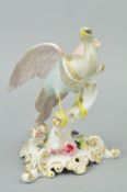 A ROYAL CROWN DERBY CHELSEA BIRD, pink, grey and blue plumage on a flower encrusted tree stump,