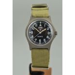 A CWC QUARTZ MILITARY WRISTWATCH, the black face with Arabic numerals and material strap, stamped