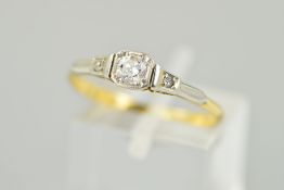 A DIAMOND RING, the central brilliant cut diamond within a square shape surround to the tapered