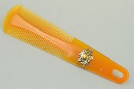 AN EARLY 20TH CENTURY COMB of tapered outline with two different sized teethh comb to either side