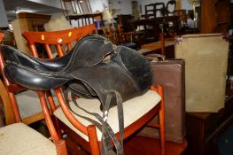 A NAVY SUITCASE, a shoe suitcase and a black leather saddle (3)