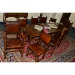 A LARGE REPRODUCTION OAK CROSS STRETCHERED DRAW LEAF TABLE on four large acorn supports, approximate