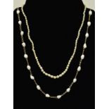 A CULTURED PEARL NECKLACE AND AN IMITATION PEARL NECKLACE, the first designed as cultured pearls