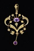 AN EDWARDIAN AMETHYST AND SPLIT PEARL PENDANT of openwork scrolling design set with split pearls,