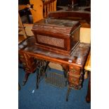 A MAHOGANY TREADLE SINGER SEWING MACHINE