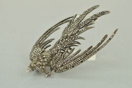 A MARCASITE BROOCH, designed as a bird in flight set with marcasites, stamped silver, length 90mm,