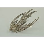 A MARCASITE BROOCH, designed as a bird in flight set with marcasites, stamped silver, length 90mm,